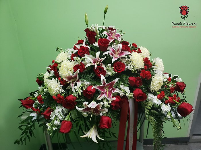 Lilies and Red Roses funeral flowers casket